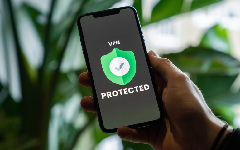 iPhone with VPN service enabled in hand