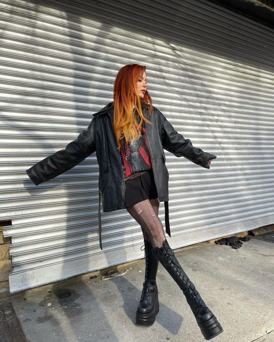 Woman posing in a Grunge aesthetic outfit.