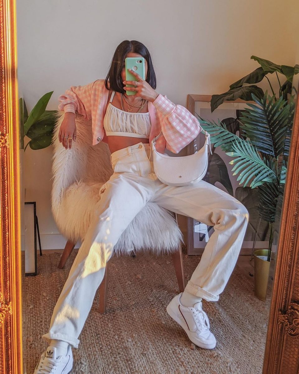 Girl posing in a pink Soft Girl aesthetic outfit.