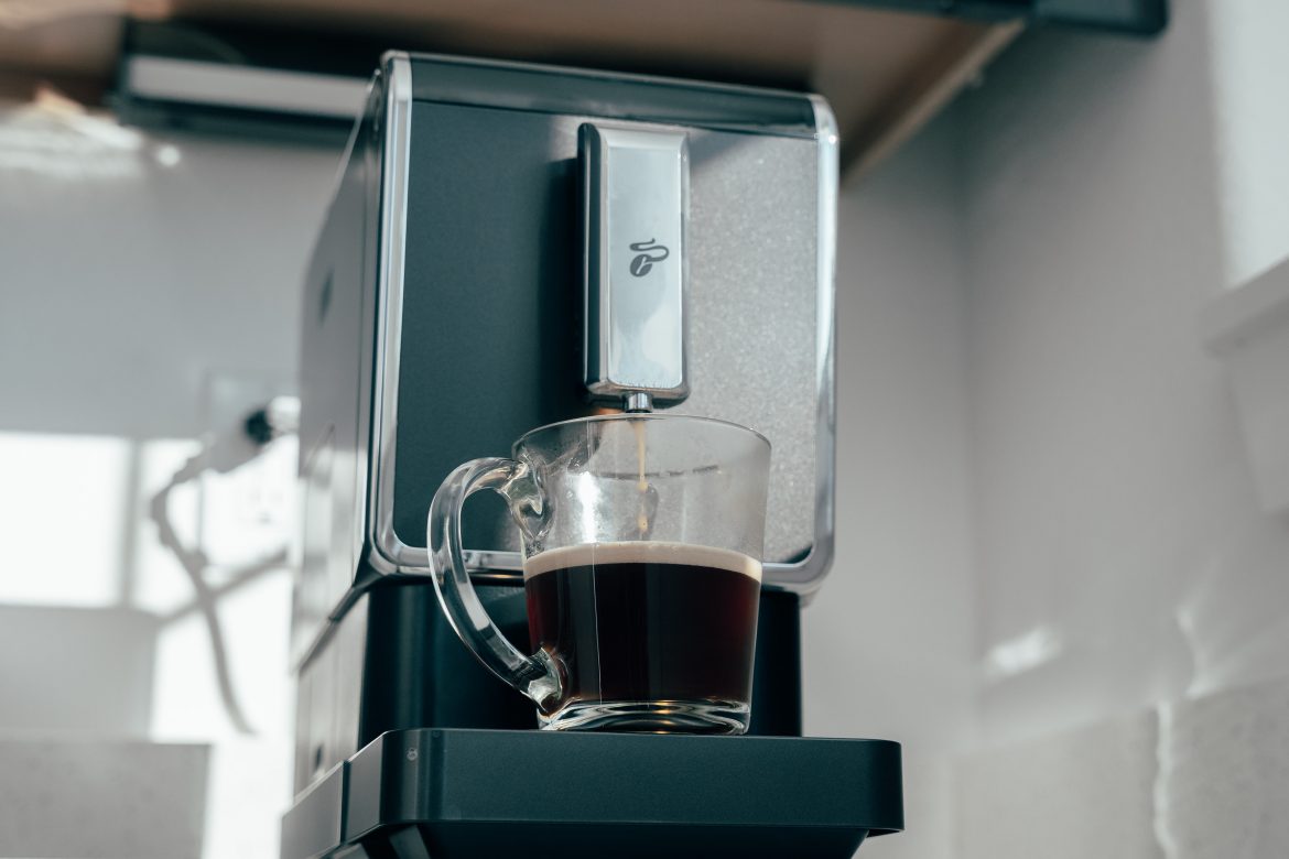 A smart coffee maker brewing a cup of coffee.