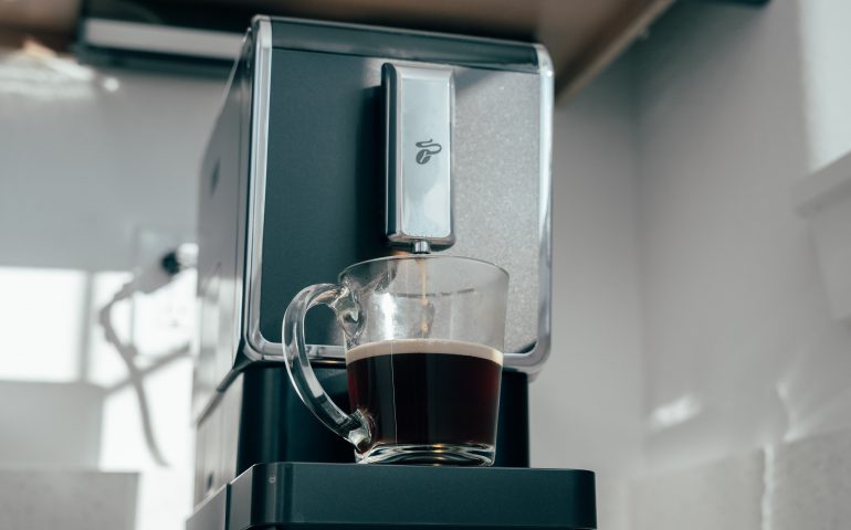 A smart coffee maker brewing a cup of coffee.