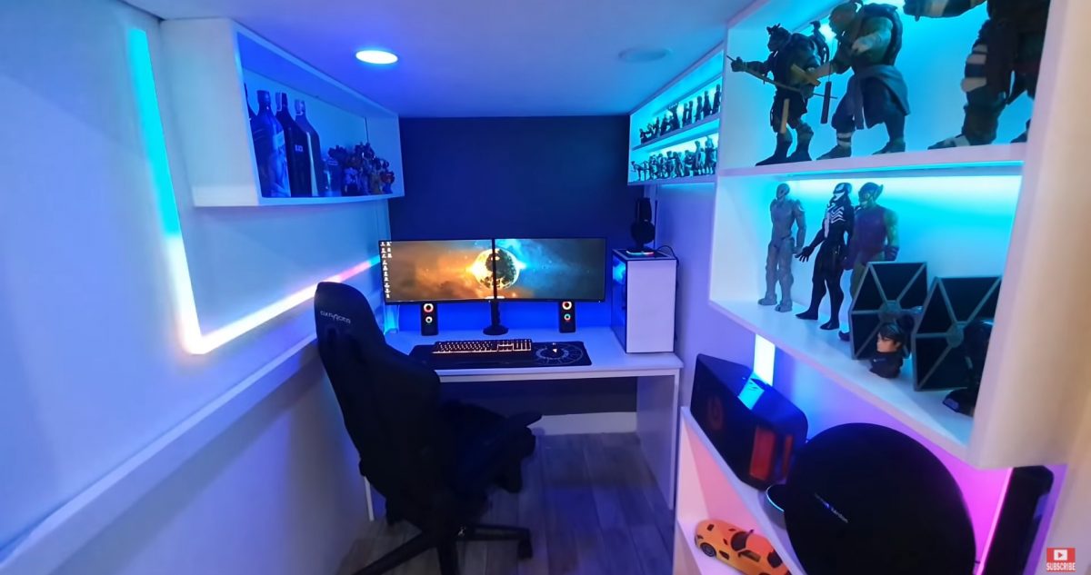 1.4m small gaming room with figurine and merch display shelves.