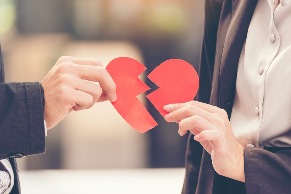 Grief divorce couple holding broken heart