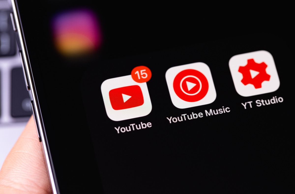 YouTube mobile apps (YouTube, Music, Studio) on screen smartphone