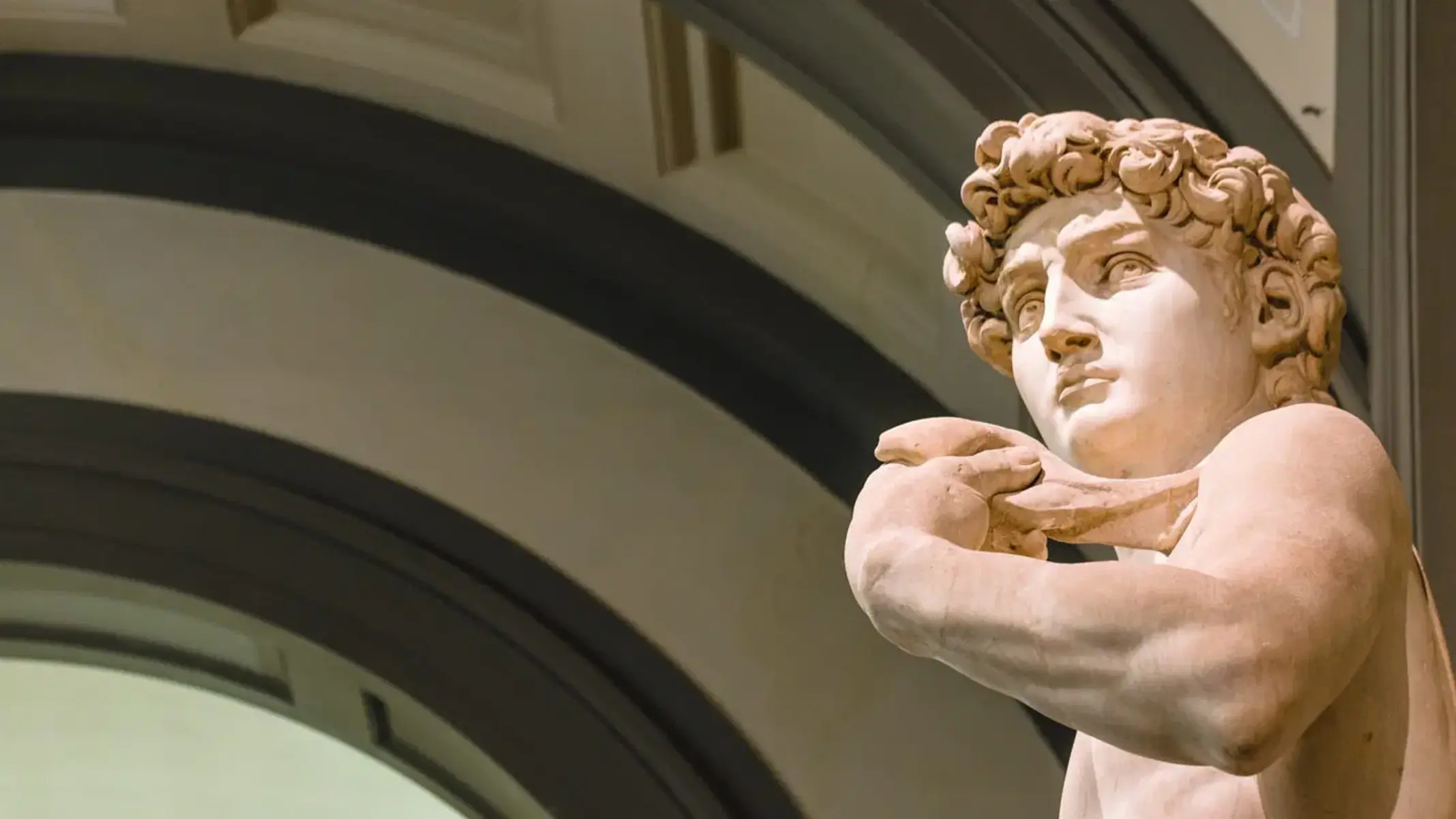 What Is David Holding In Michelangelo’s Sculpture