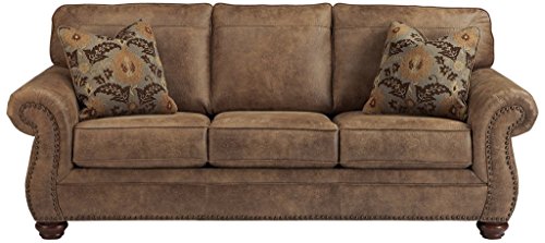 Larkinhurst Faux Leather Sofa with Nailhead Trim and 2 Accent Pillows