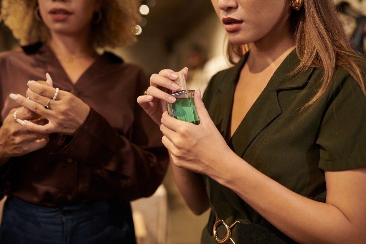 Women testing new perfumes in boutique