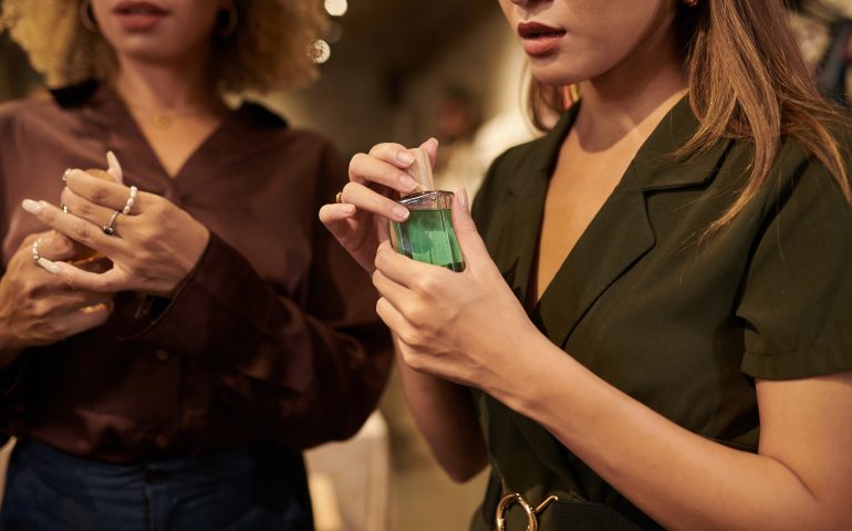 Women testing new perfumes in boutique