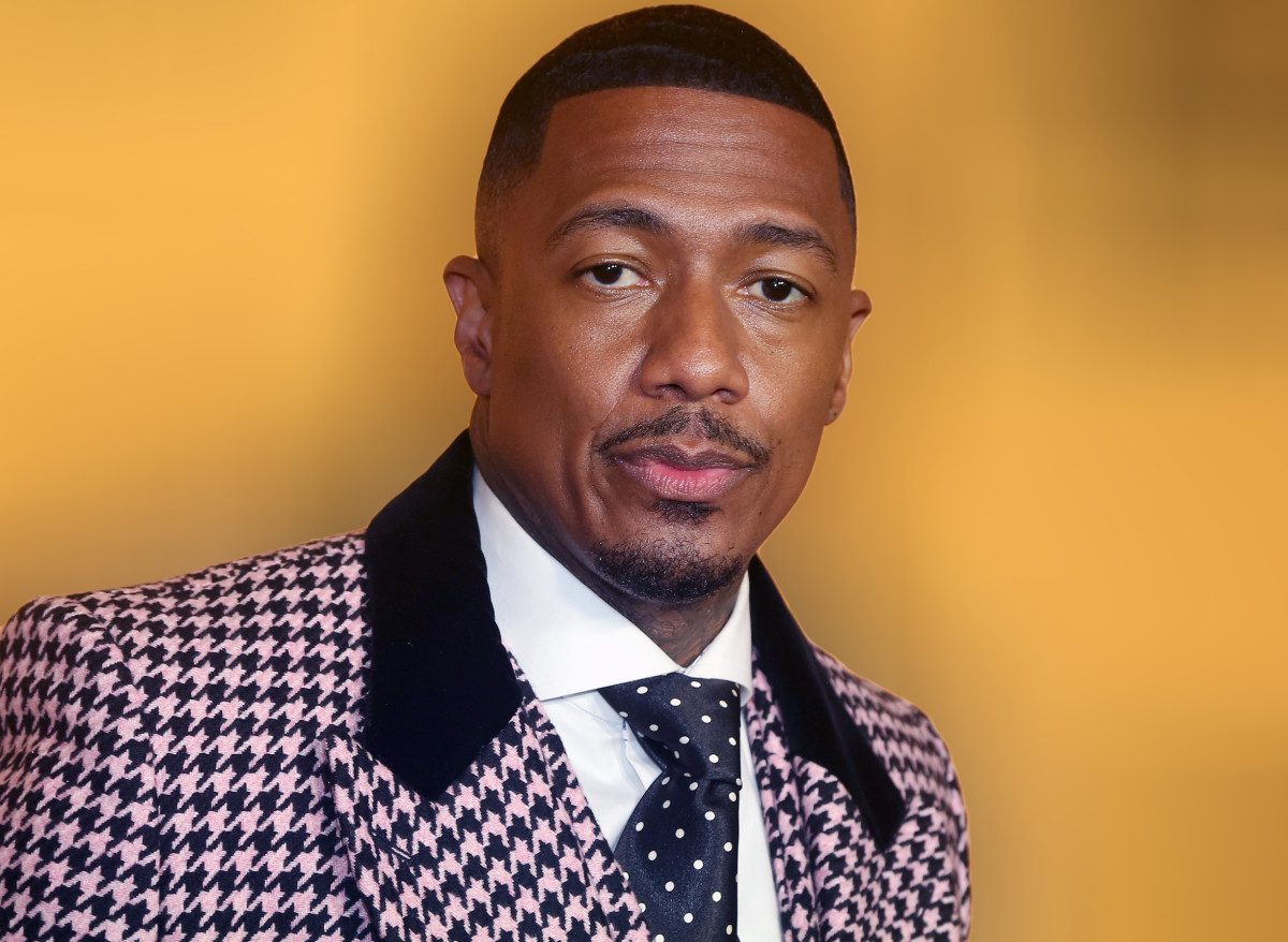 Nick Cannon Shares Adorable Christmas Photos With One Of His 12 Kids
