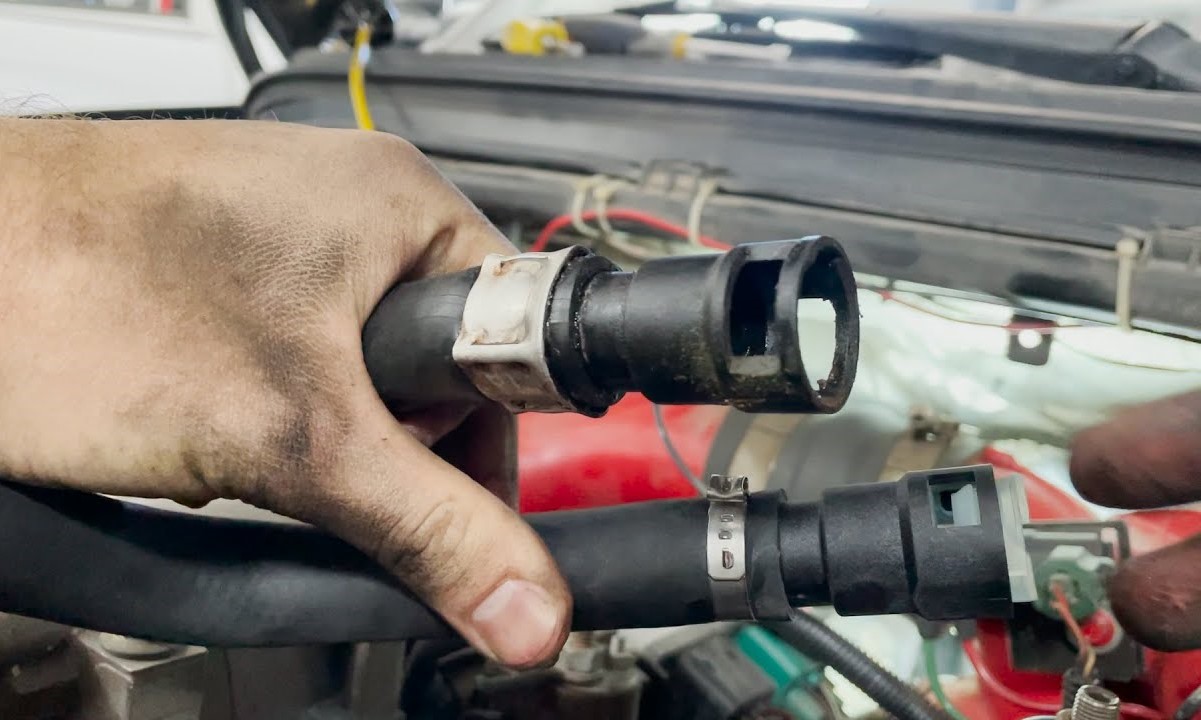 Steps For Safely Removing A Heater Hose Connector In A Ford Vehicle
